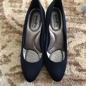 Navy blue coach and four pumps